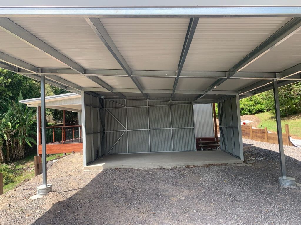 Carport with side panels and storage